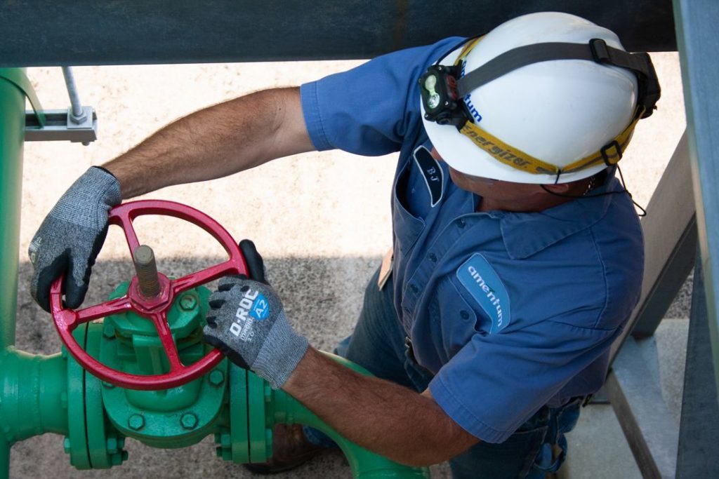 Amentum Caterpillar Technician Adjusts Coolant System Valve